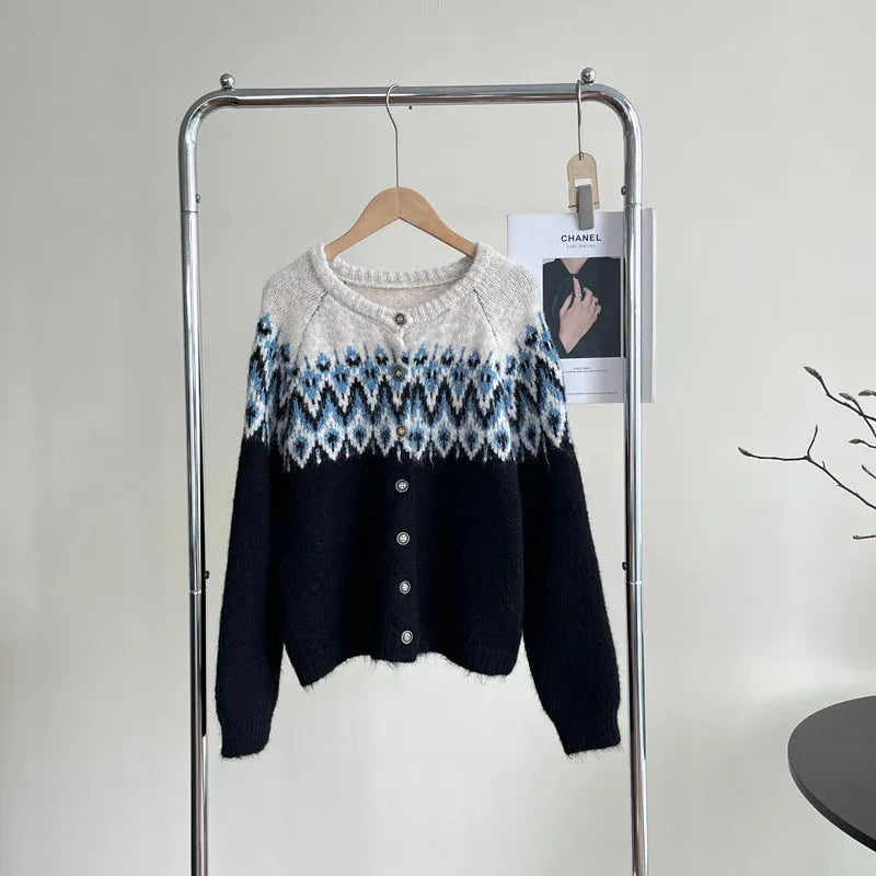 Women's thick jacquard knit sweater coat in a loose fit, shown in milky white colour with long sleeves.