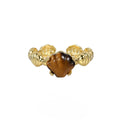 Silver adjustable ring with a tiger eye shell design and gold electroplated finish.