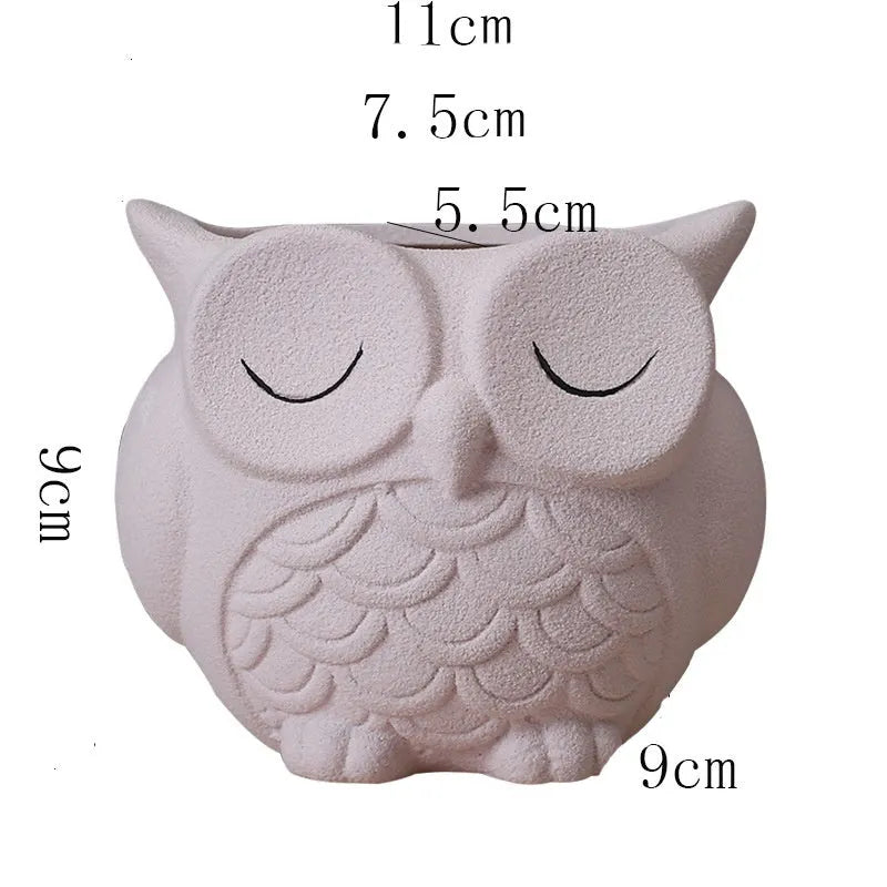 Handmade frosted ceramic owl pot for succulents in light pink, dimensions 11x9x9 cm.