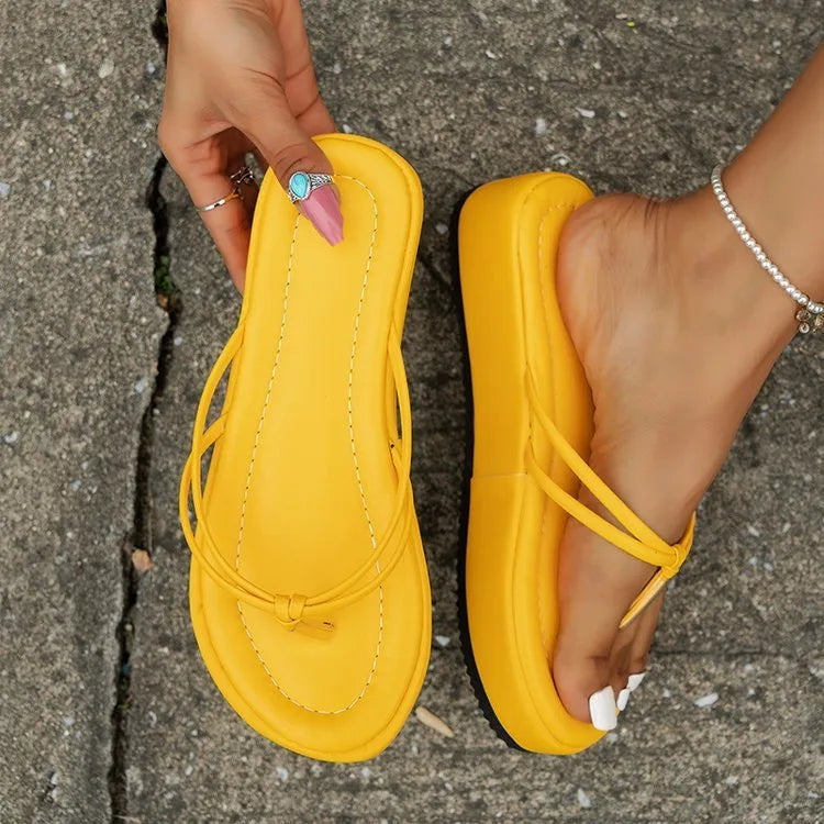 Women's thick sole flip-flops in multiple colours with herringbone pattern PU strap and rubber sole.