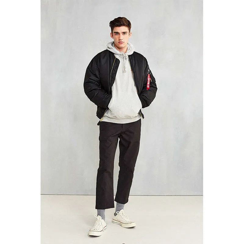 Men's loose fit cotton-padded nylon pilot jacket in army green on a hanger.