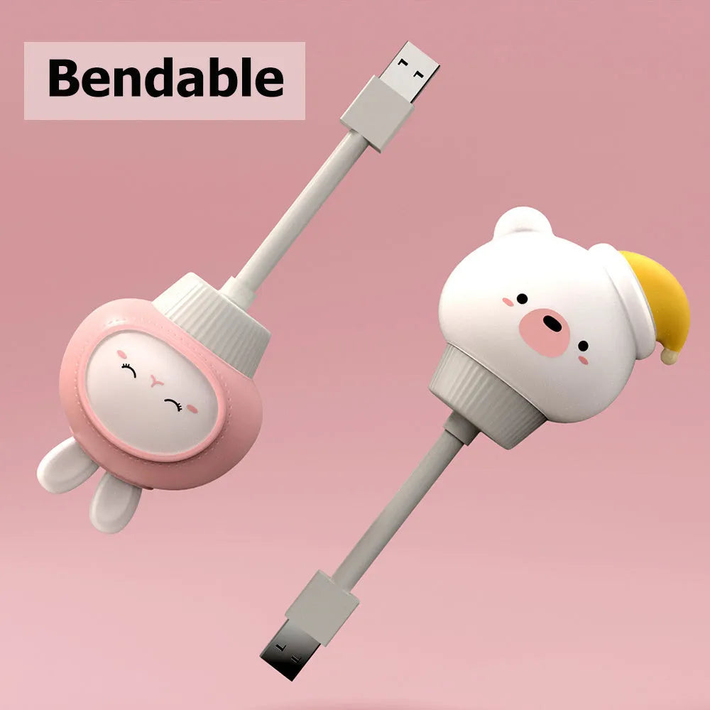 Cartoon bear or rabbit USB LED night light with remote control on a bedside table
