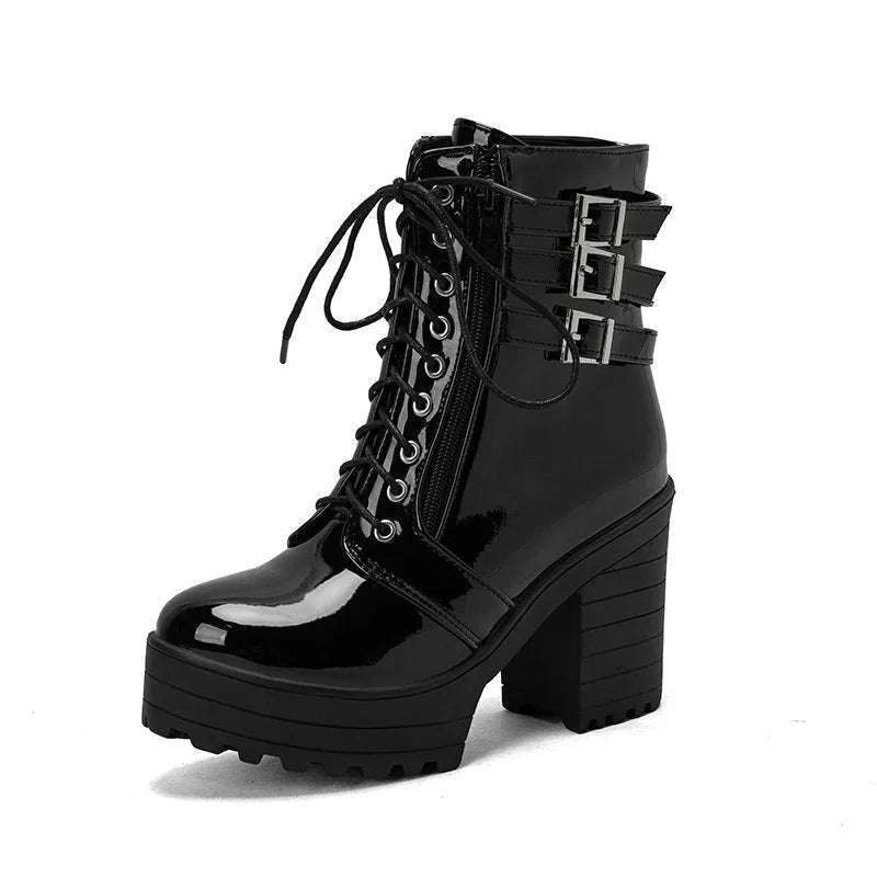 Women's black thick-heel ankle boots with round toe and front lace-up design.