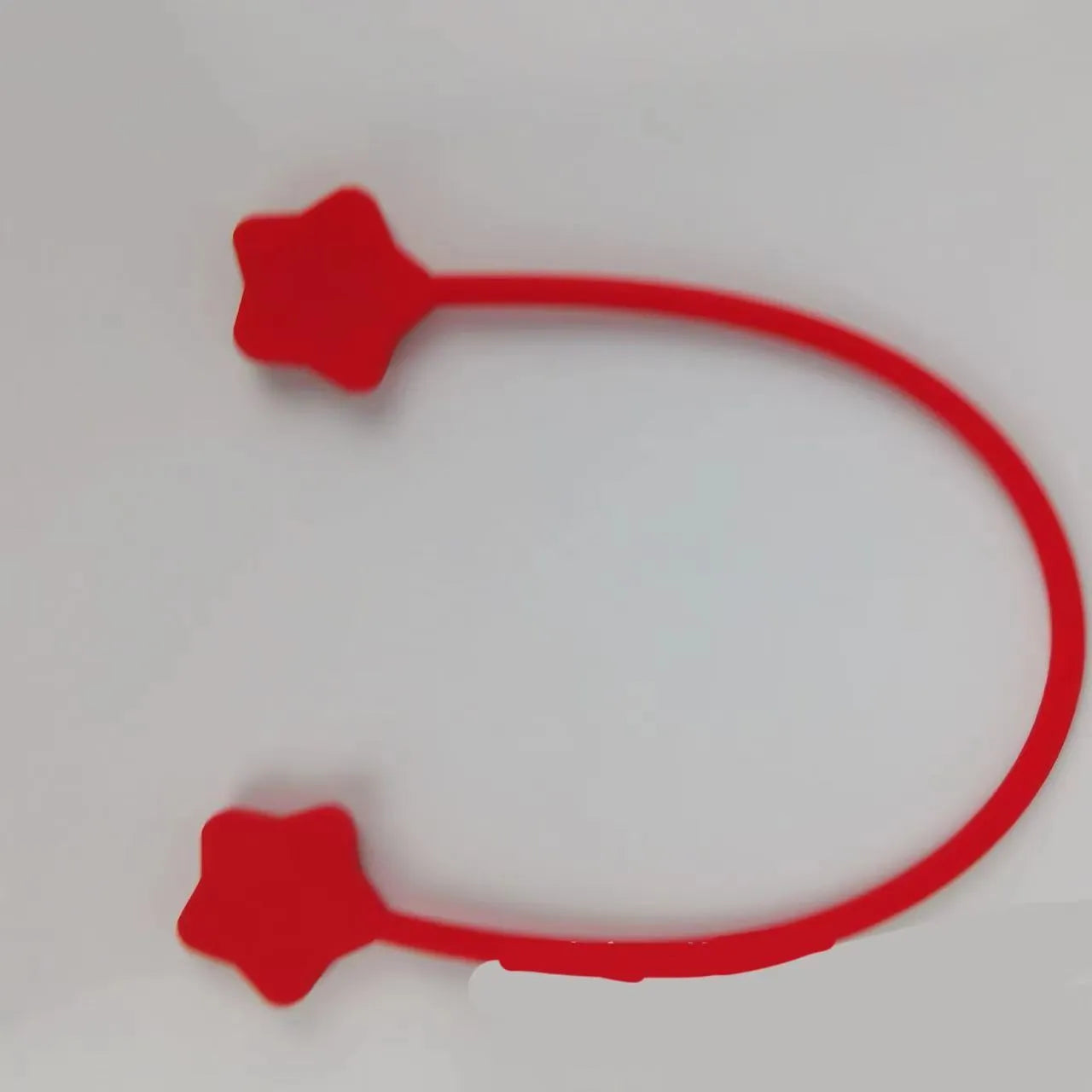 Star magnet silicone wire winder clip in various colours showing wire organisation function