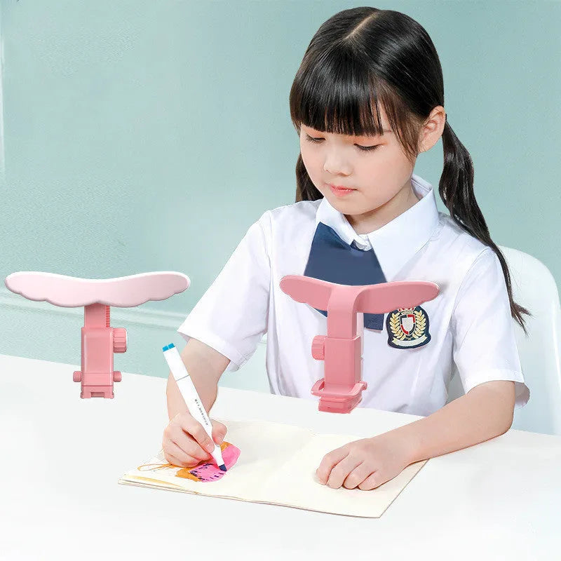 Student anti-myopia posture corrector orthosis with silicone and ABS frame, available in blue and pink, for desk or card table use