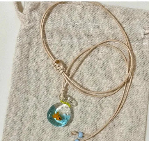 Women's necklace with coloured glaze pendant on a cotton and linen clavicle chain.