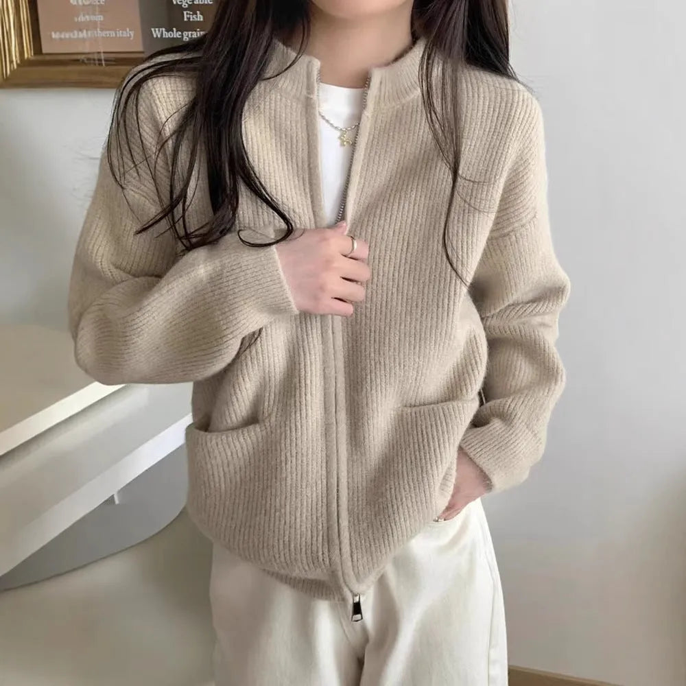 Beige viscose knit long sleeve cardigan sweater coat on a hanger