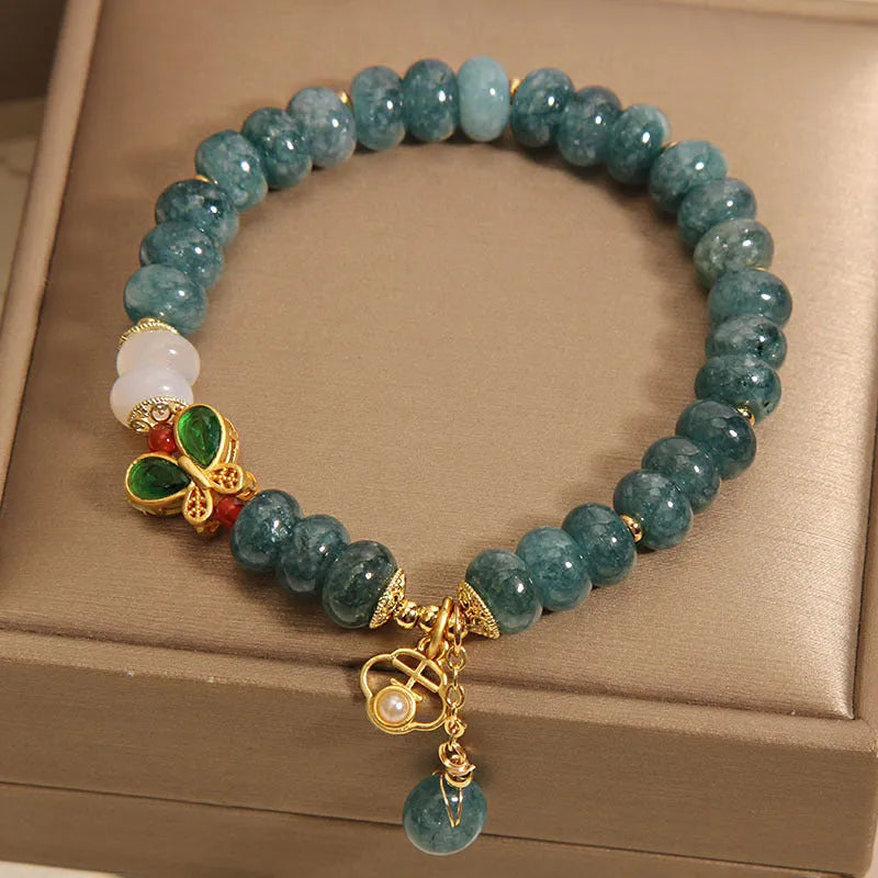 Blue water jade abacus beads crystal bracelet with white agate and rhinestone accents on alloy