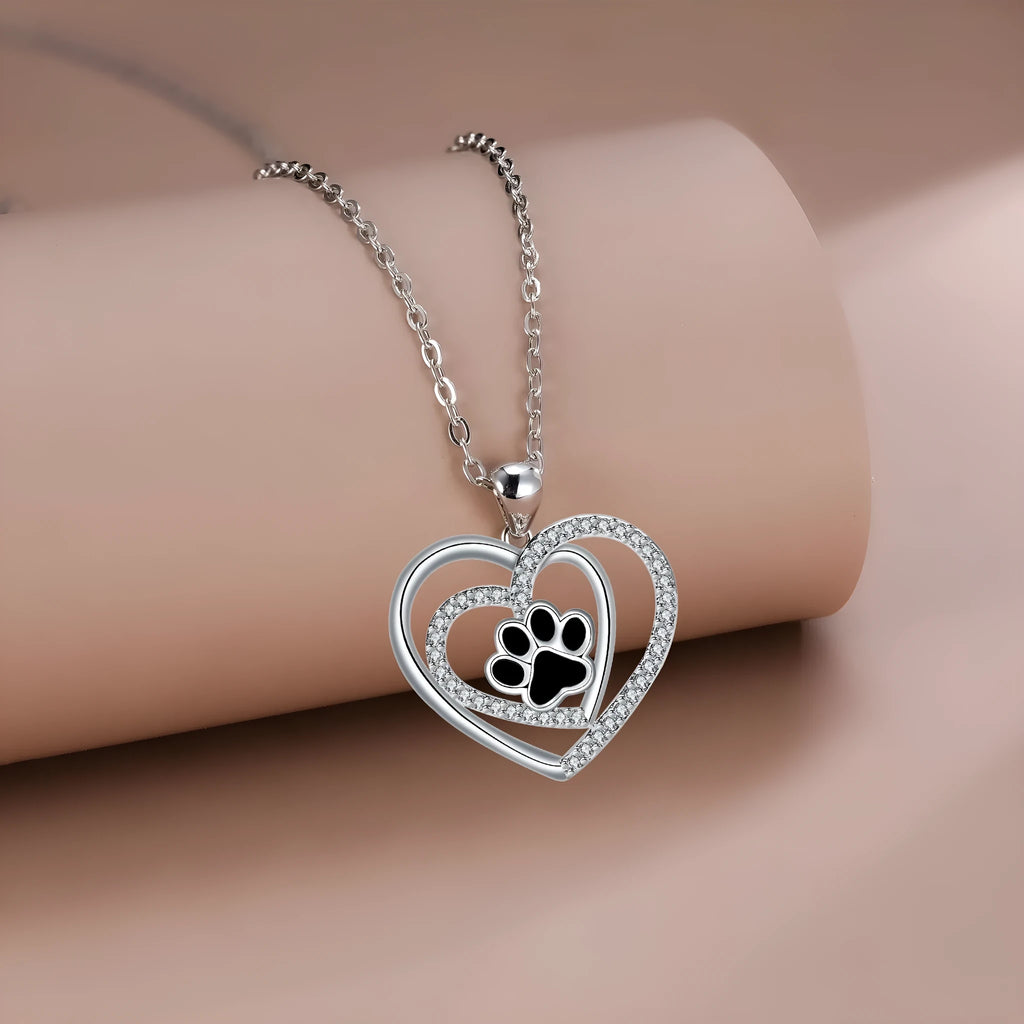 Dog paw print necklace with heart-shaped pendant on cross chain for women
