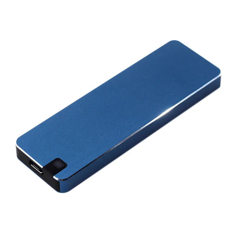 White metal portable external SSD hard drive with USB cable on a grey background