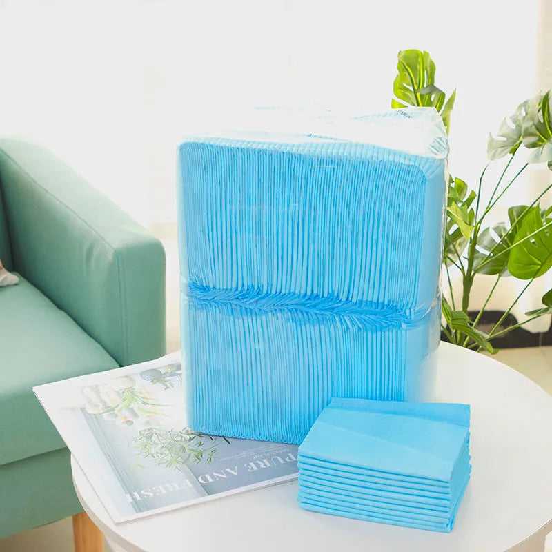 Pack of pet urinal pads showing different sizes and absorbency types for dogs and cats
