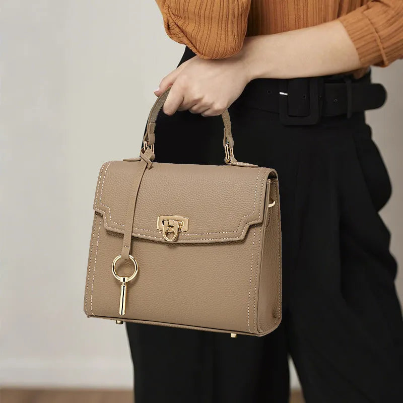 Elephant grey genuine leather handbag with litchi pattern texture and vintage lock closure