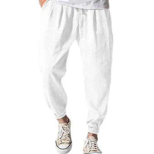 Men's casual cotton trousers with banded ankles in light green colour showing loose fit summer style