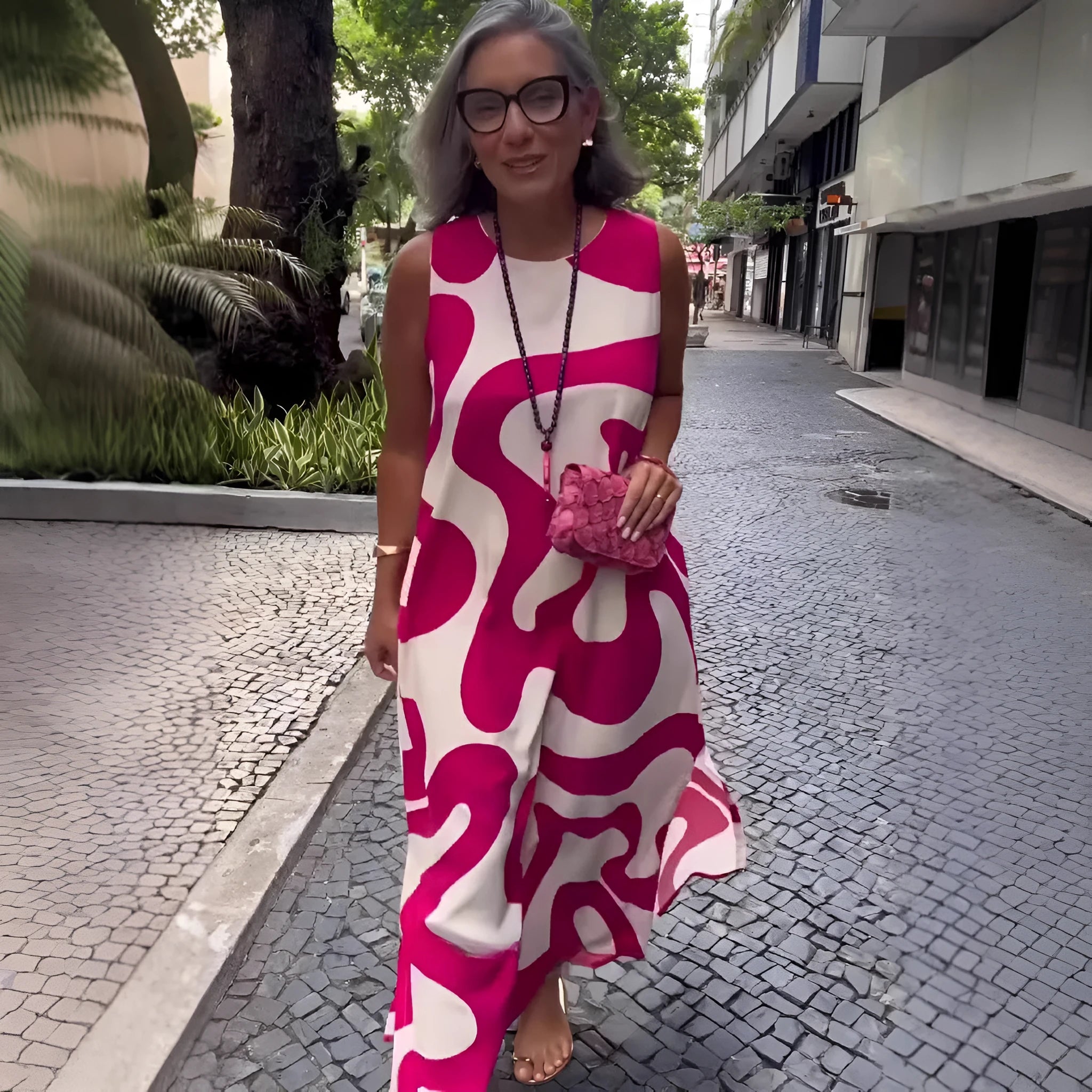 V-neck printed sleeveless dress in Rose Red with abstract pattern and A-line skirt for commuting style