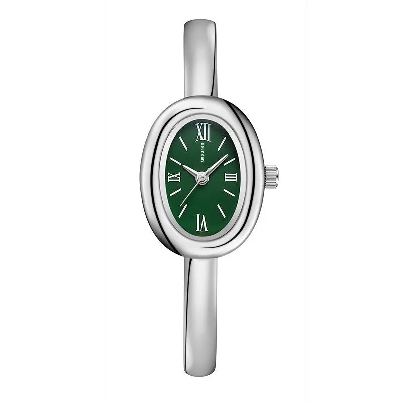 Women's slim oval retro quartz watch in gold colour on wrist