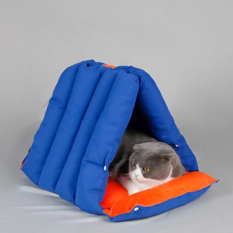 Blue triangular cotton cat bed with a removable cover, showing drilled holes on the side for combination.