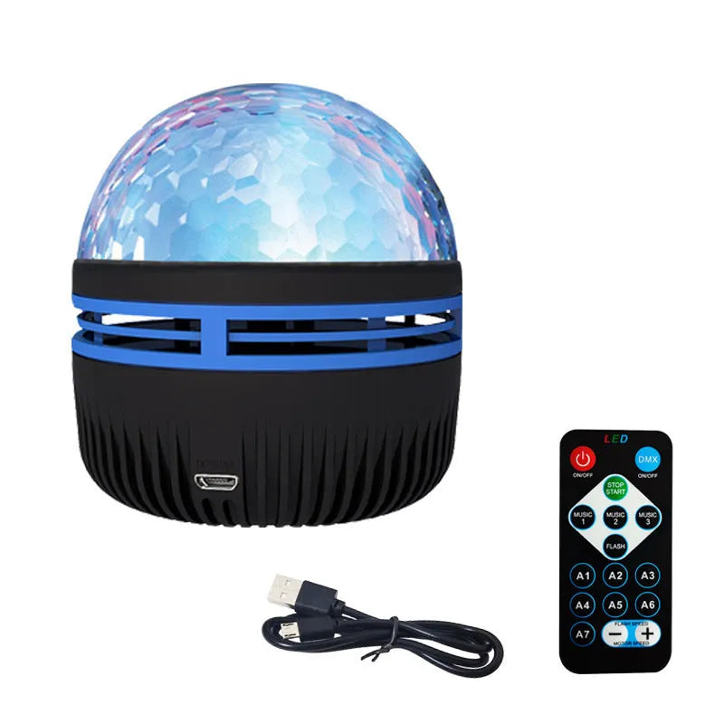 USB-powered LED galaxy projector lamp with rotating ball on a table, showing starry light projection.