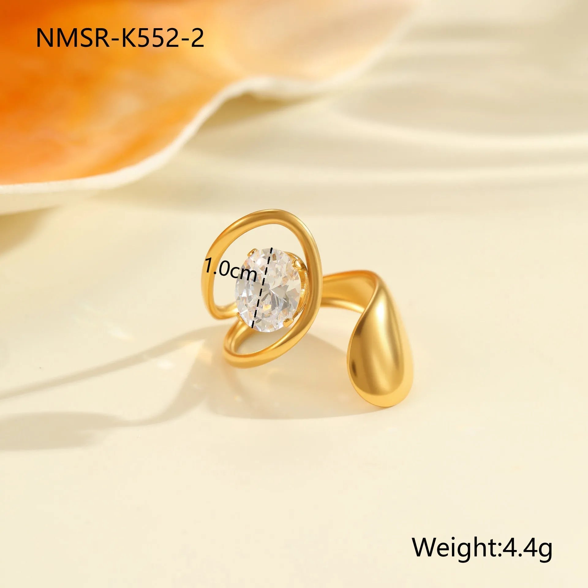 Geometric stainless steel zircon ring with open mouth design on a hand.