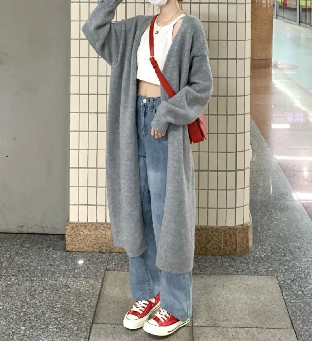 Women's loose knitted chenille cardigan in dark grey showing 3D pattern texture