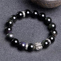 Natural obsidian stone bead bracelet with a silver clasp, shown in male 12mm and female 10mm size options.