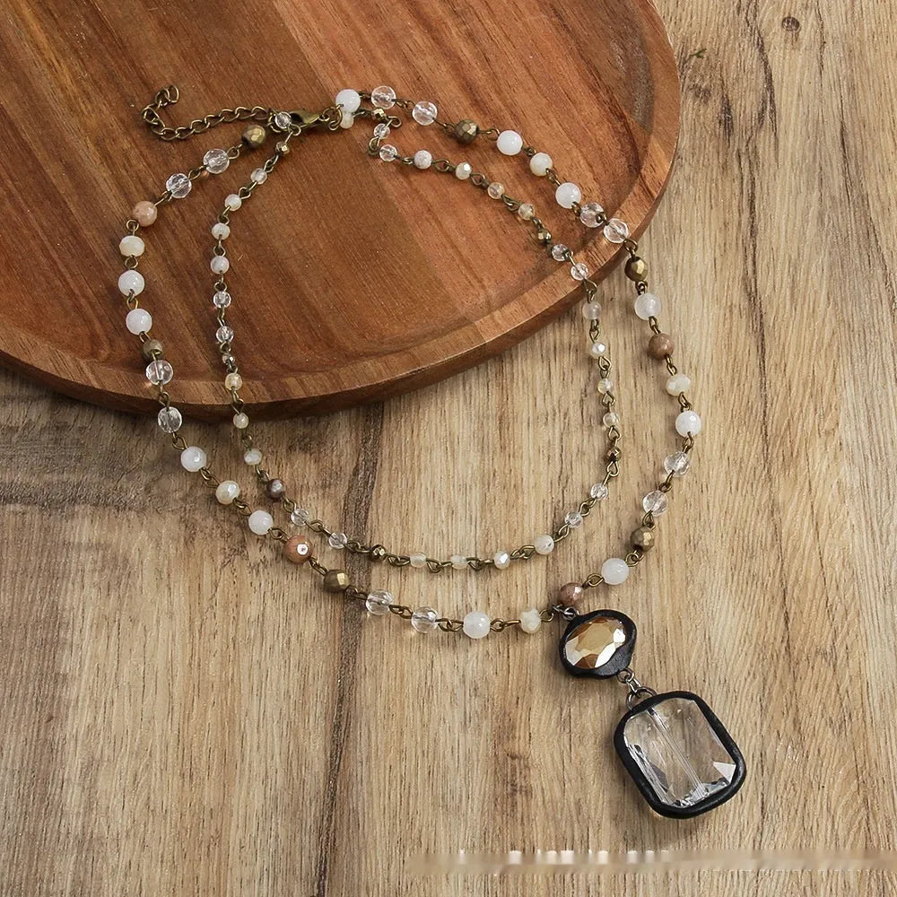 Retro tribal style 2-layer necklace with natural stone and glass pendants in beige or blue colour