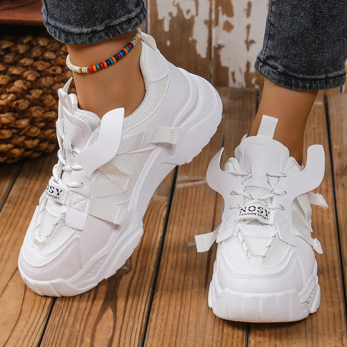 Women's platform sneakers in purple with mesh upper, animal pattern detail, and lace-up front.