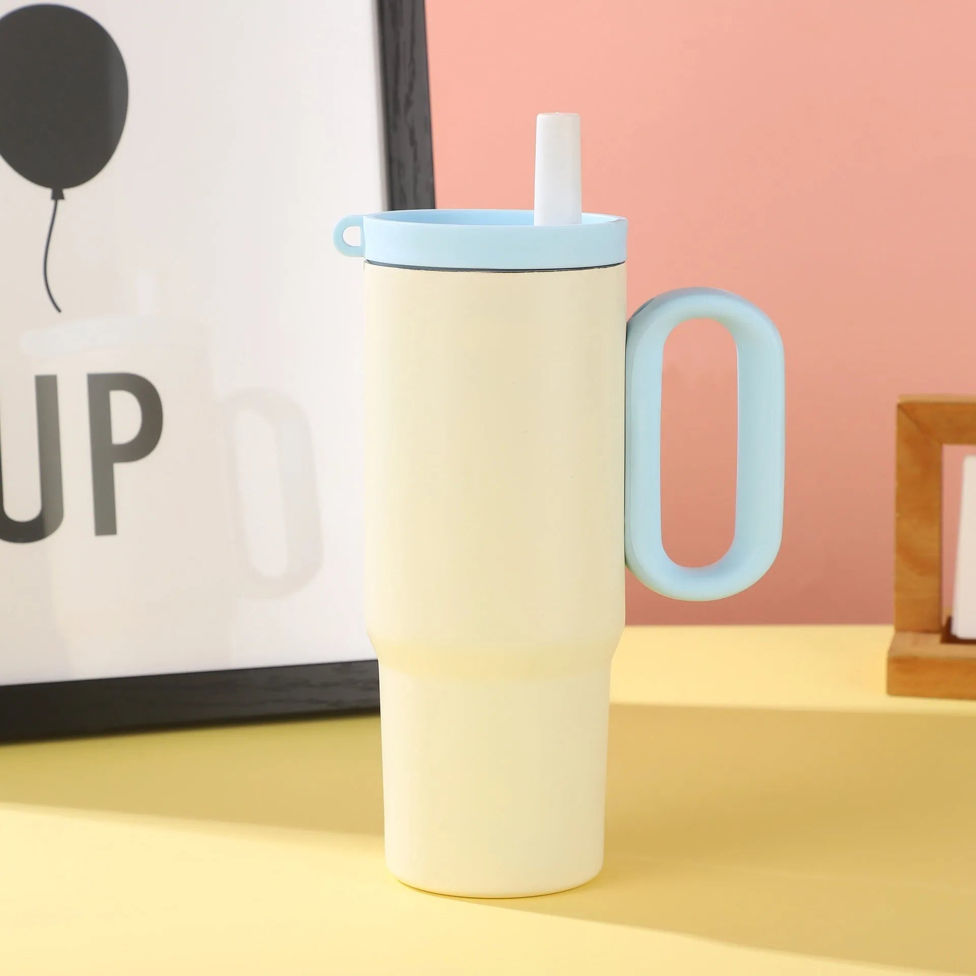 DIY Vitality large insulated straw cup with handle in black, pink, blue, white, or yellow.