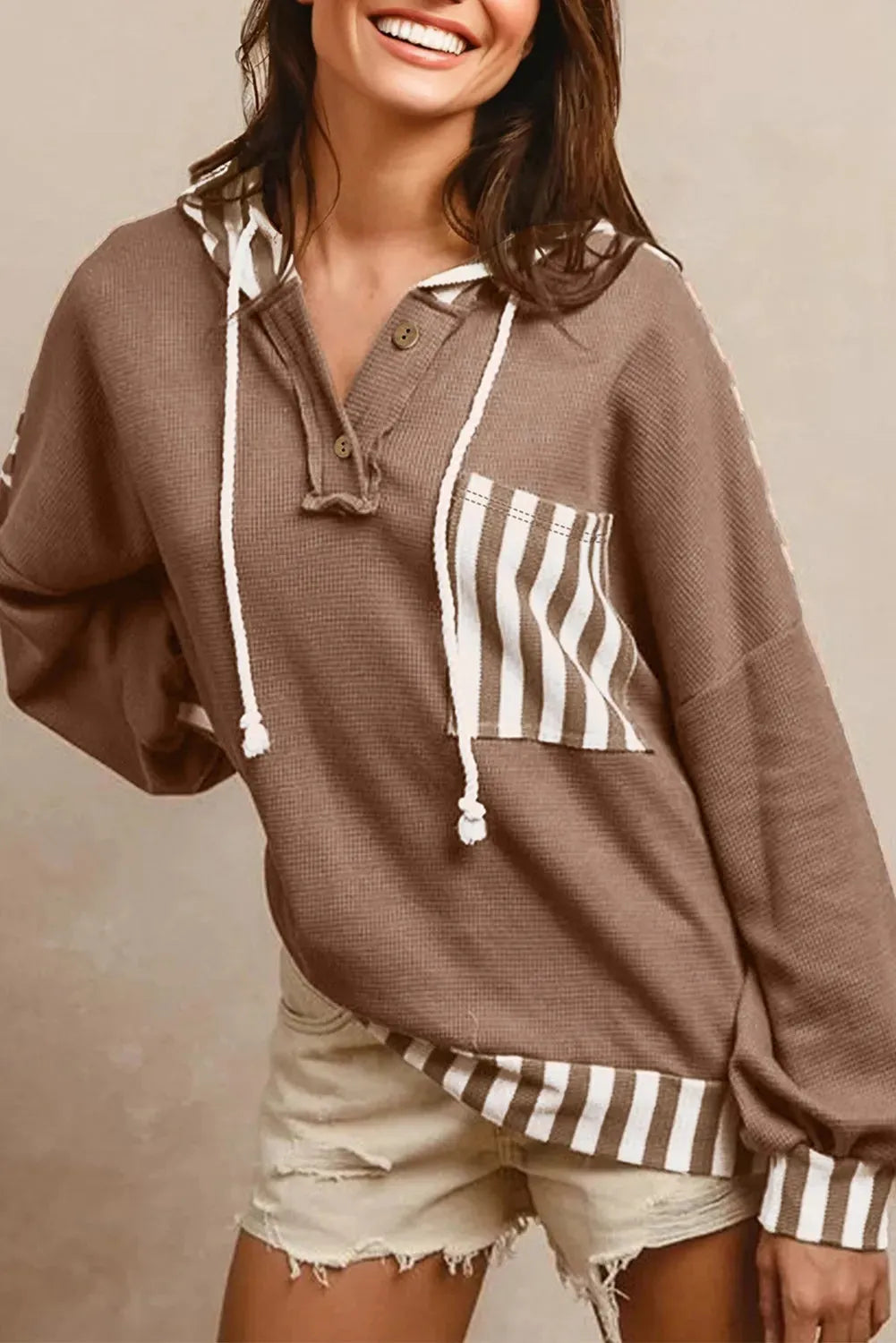 Straw yellow waffle texture striped patchwork hoodie with button neck and drawstring hood.