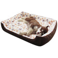Camel coloured plush dog bed with sofa-style bolsters for small dogs, shown in Large 70x55cm size