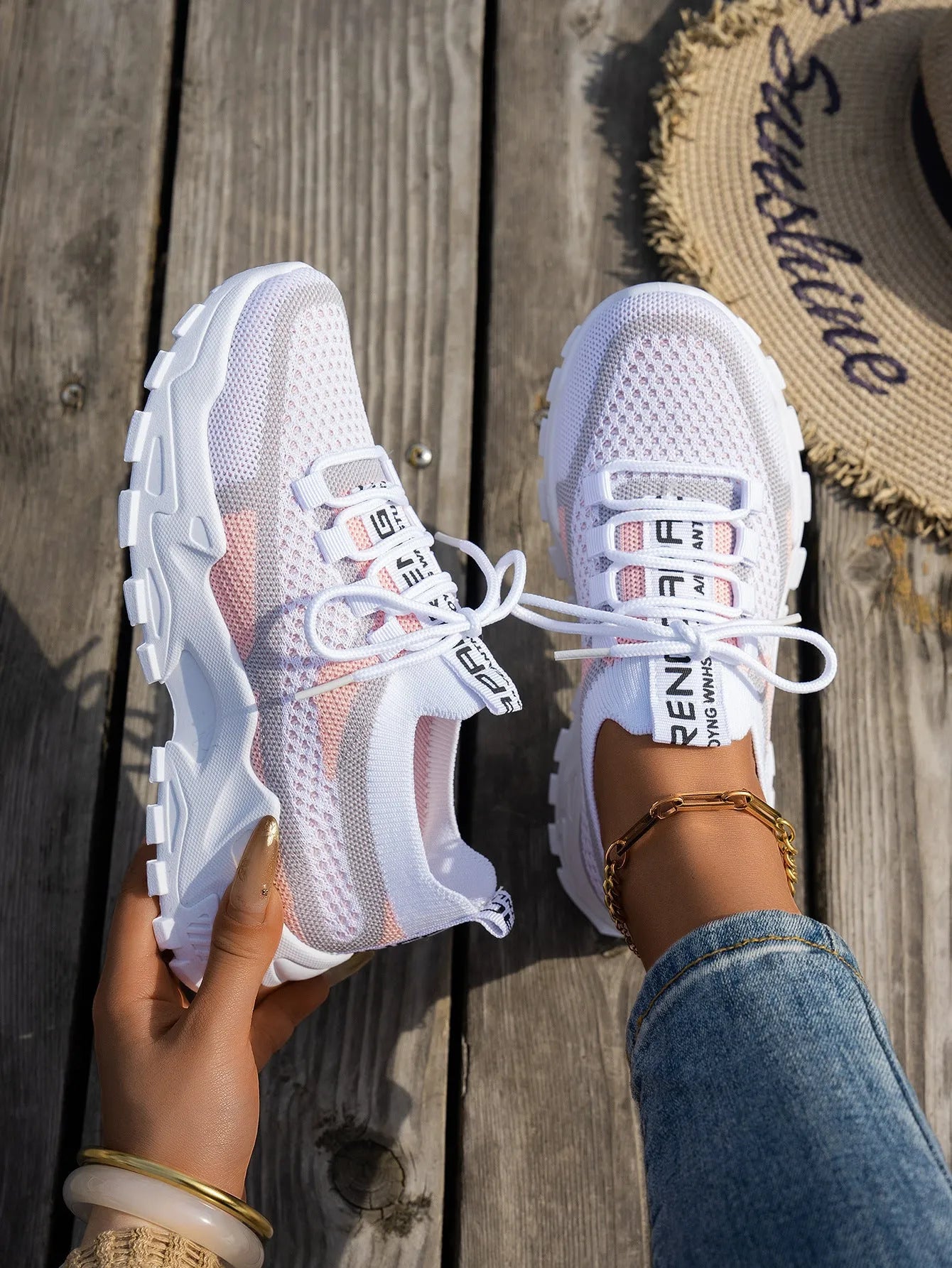 Women's Flyknit Mesh sneakers in a neutral colour showing lace-up design and rubber sole.