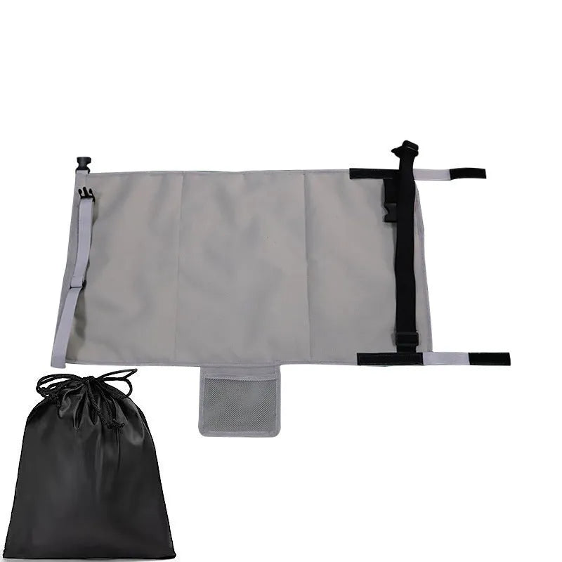 Portable blue nylon aircraft seat extender for children with drawstring storage pocket attached