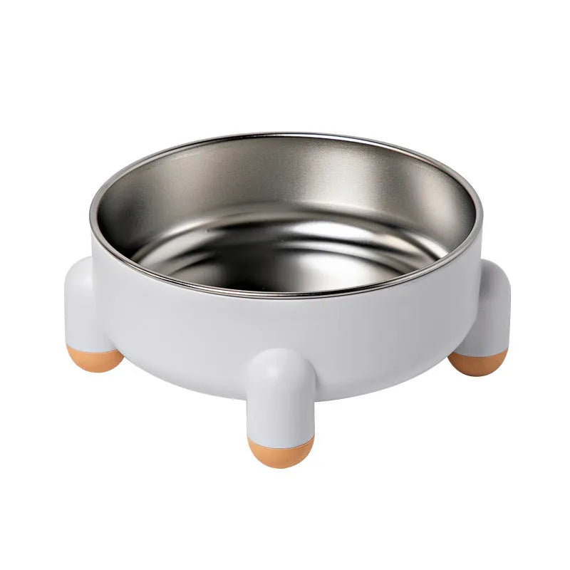 Green stainless steel pet bowl with a high foot and non-slip base on a kitchen floor.