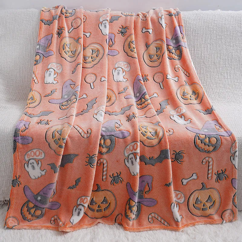 Children's cartoon flannel blanket in colourful design on bed