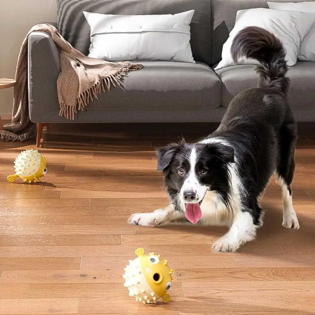Yellow fish-shaped vinyl dog chew toy with textured surface and squeaker for aggressive chewing dogs