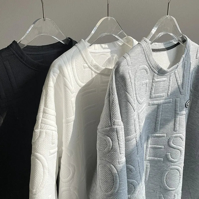 Men's grey loose-fit T-shirt with a raised white three-dimensional letter print on the chest.