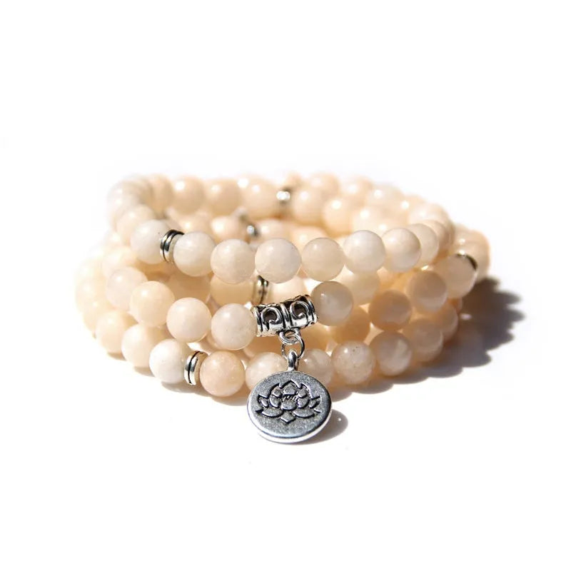 Vintage natural stone bracelet for women with a geometric lotus pendant on a model's wrist.
