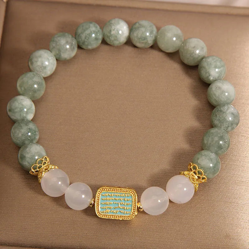 Women's oil green emerald crystal bracelet with five scriptures design on white background