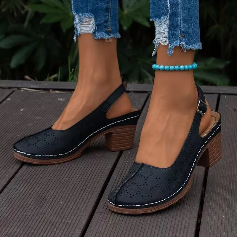 Women's black closed toe wedge sandals with round toe and rubber sole on a size label showing 36-43.