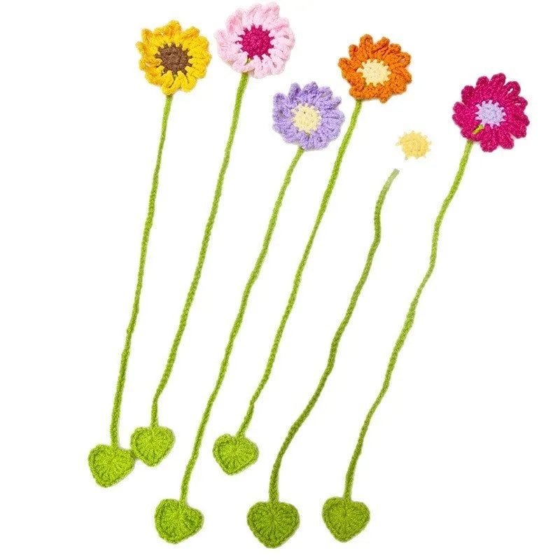 Hand-crocheted wool bookmark with flexible wire core and little daisy design in milk cotton yarn