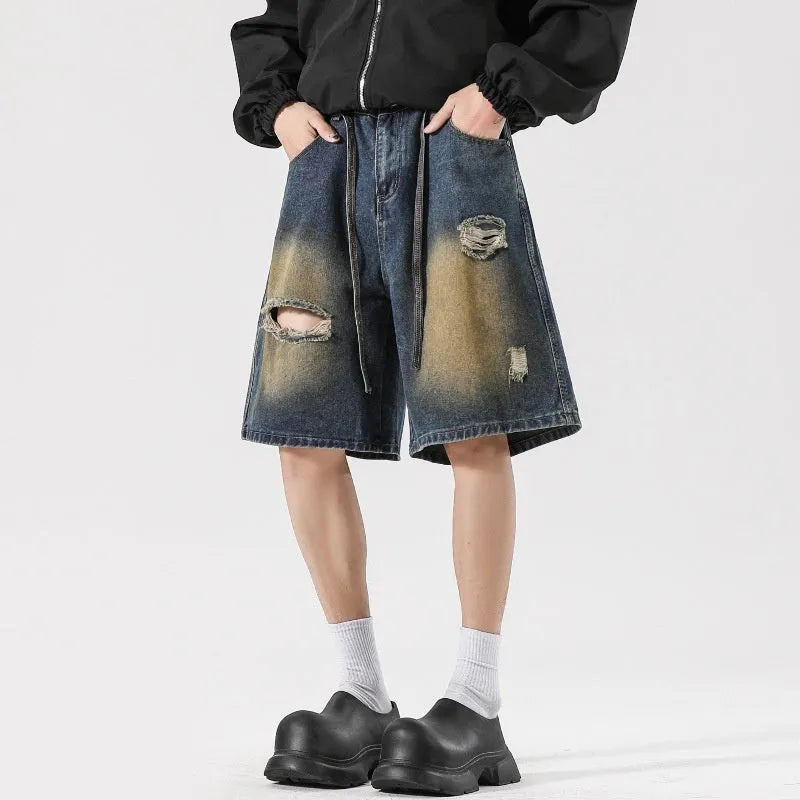 American High Street men's loose fit ripped jeans in retro blue denim showing distressed detail.