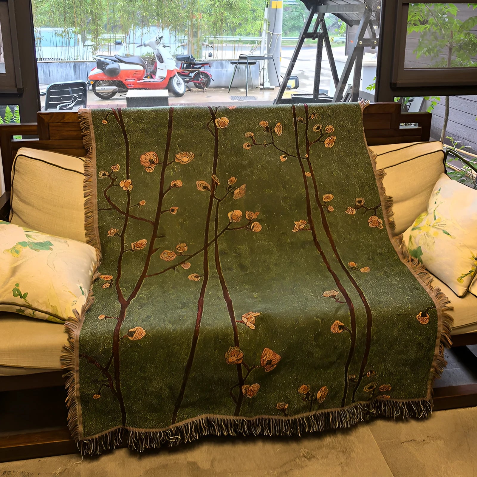 Chinese retro green plum blossom woven polyester sofa cover 130x160cm with tassels on a sofa