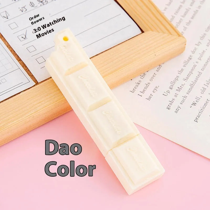 Chocolate ballpoint pen with cartoon food design in pink, beige, and brown colours