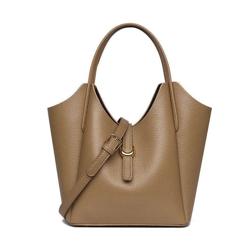 Genuine leather women's retro bucket handbag in beige with top handles and visible stitching.
