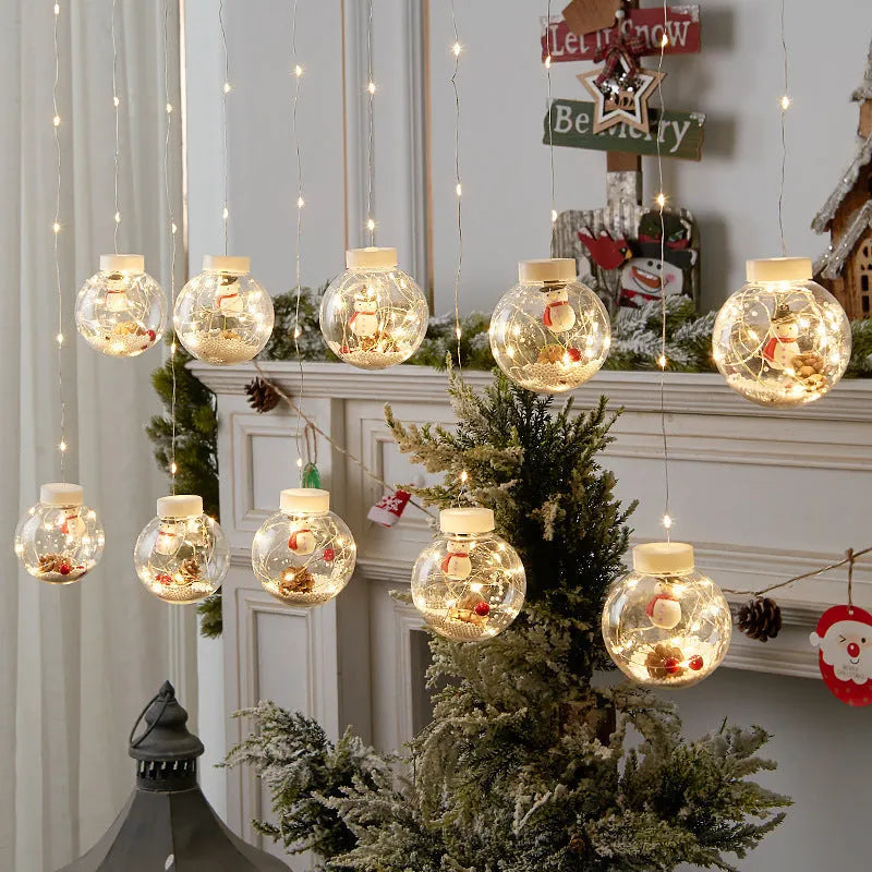 Christmas curtain light string with ten LED wishing ball lamps showing snowman, Christmas tree and elder designs
