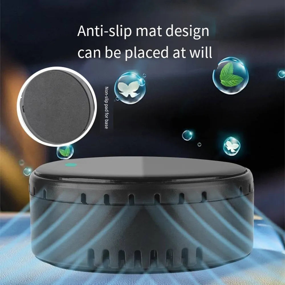 Black solar-powered car humidifier mounted on a vehicle air conditioning vent.