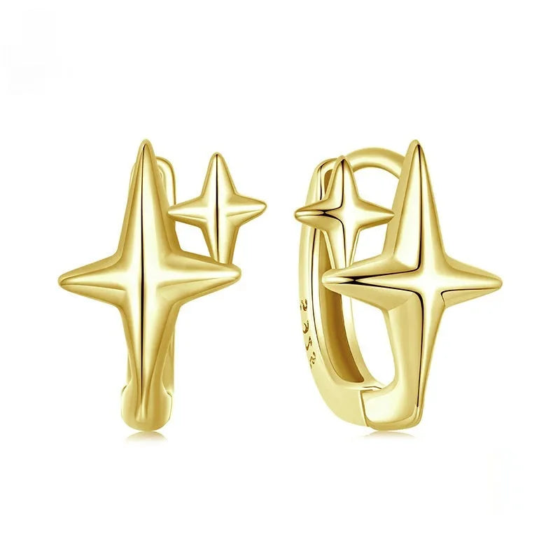 Minimalist oxidised sterling silver ear clips with geometric star designs