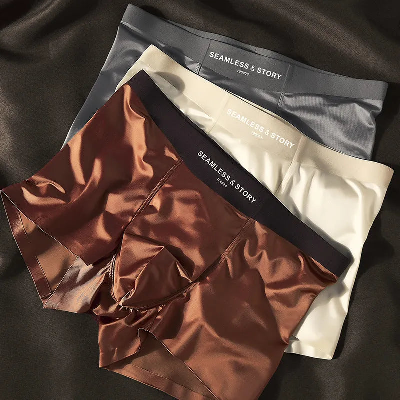 Men's solid colour ice silk nylon underwear in mid waist design on a neutral background.