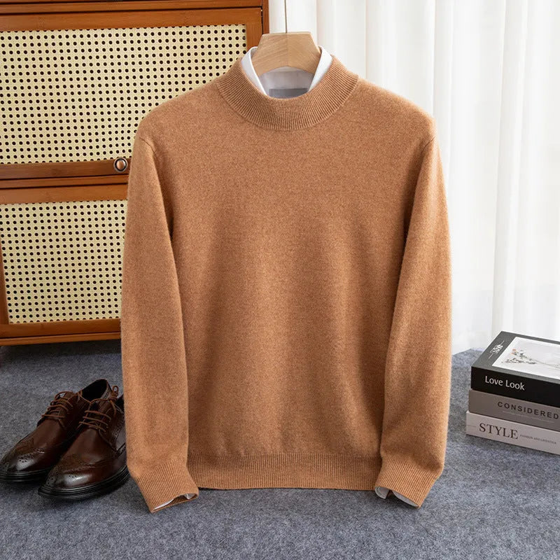 Man wearing a half-collar loose wool sweater in a textured rough yarn knit.