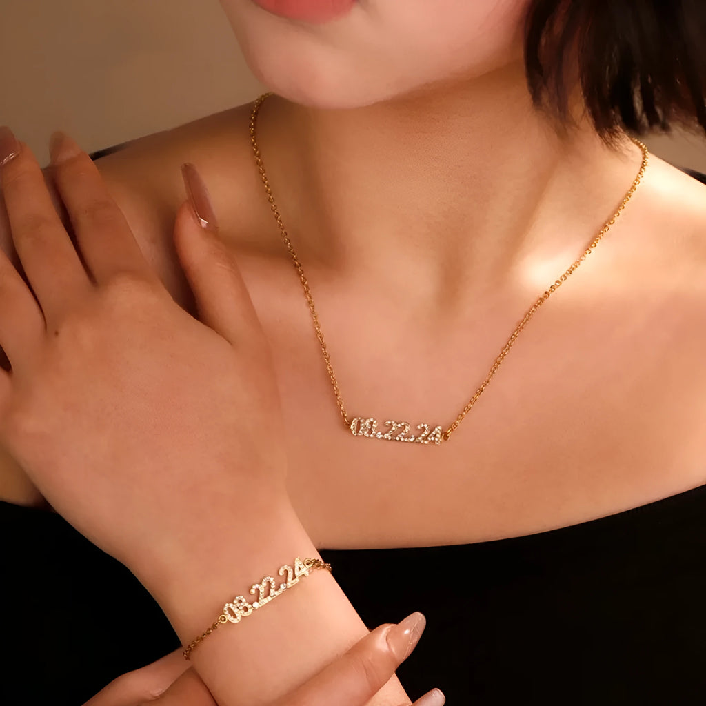 Stainless steel digital bracelet with crystal-set numbers on dial, shown in gold colour.