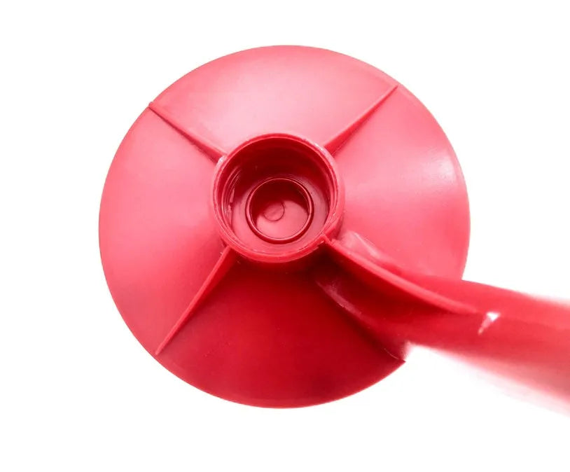 Red plastic Magic Tap soda dispenser attached to 2-litre bottle with push-button tap